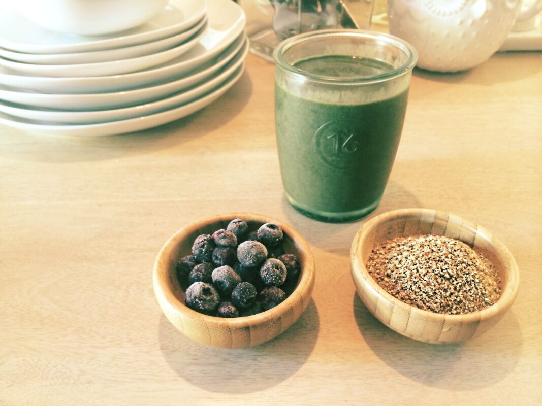 breakfast smoothie made of nutrient-dense produce (spinach and blueberries), a healthy fat (avocado), protein, fiber and omega 3’s (ground hemp and flax seeds) and a natural immunity boost (a touch of local honey).