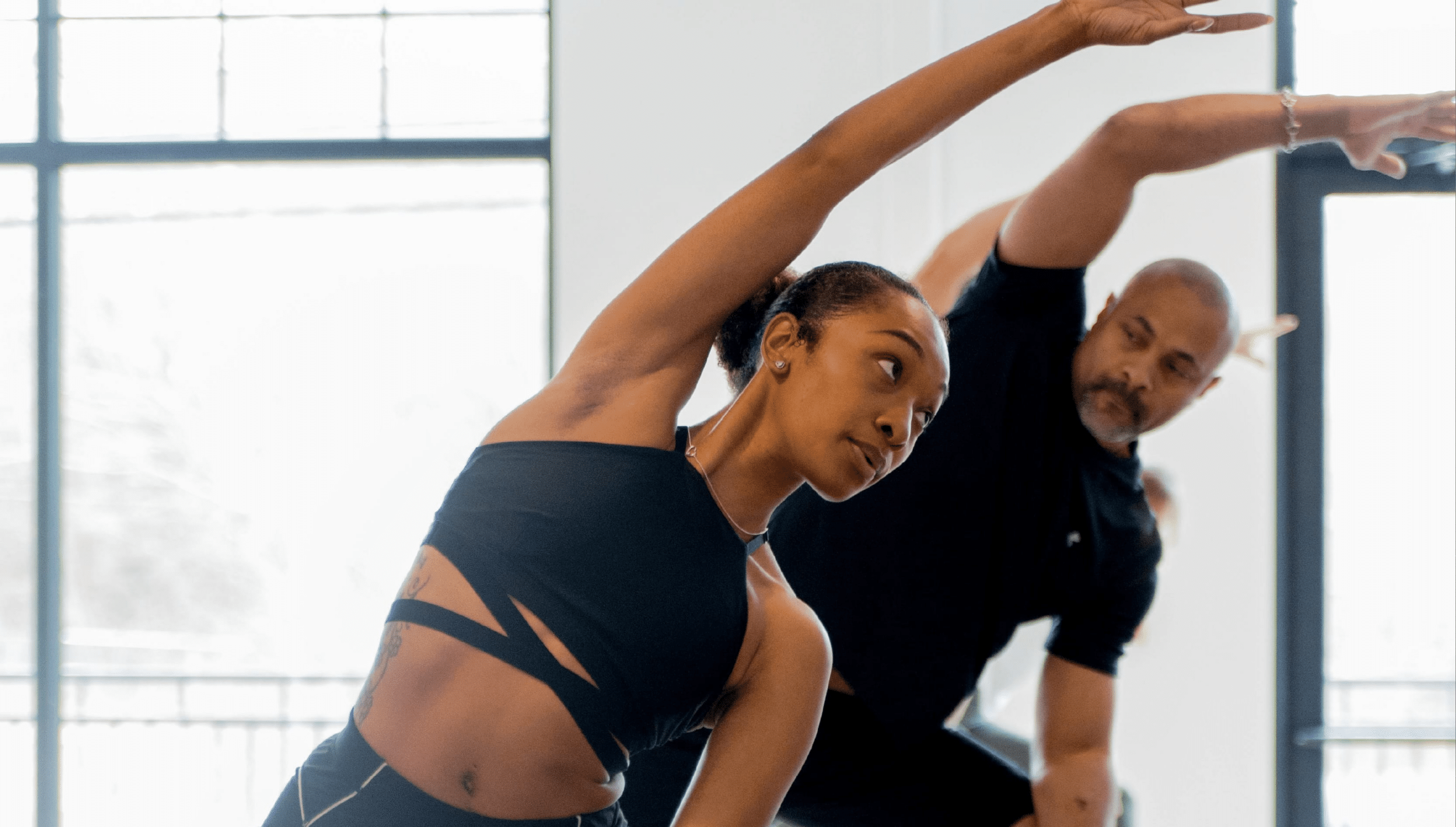 a man and a woman exercising at Bodybar Pilates