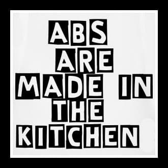 Text reads: “Abs are made in the kitchen” in bold, black and white block letters on a plain background.