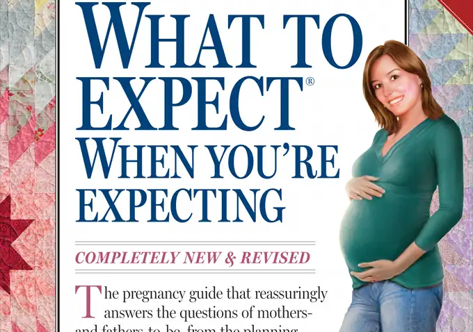 Pregnant woman smiling and holding her belly next to large book title: “What to Expect When You’re Expecting.”.